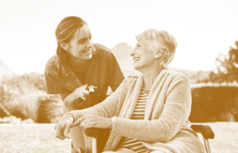 caregiver and senior smiling