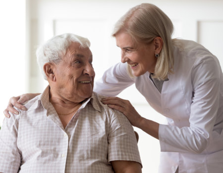 doctor and senior smiling