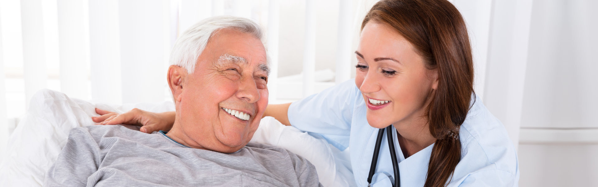 senior and caregiver smiling